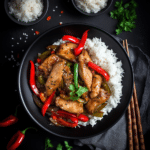 Black Pepper Chicken: The 1 Ultimate Stir‑Fry Recipe for Bold Flavor Lovers 7 Black Pepper Chicken stir-fry with sliced chicken, red and green bell peppers, and onions in a glossy black pepper sauce, served in a bowl with steamed jasmine rice on the side.