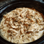 Creamy Crockpot Crack Chicken (Easy, Cheesy & Addictive Slow Cooker Dinner) 11 shredded creamy Crockpot crack chicken in a slow cooker, mixed with melted cheese, herbs, and bacon bits in a rich, creamy sauce
