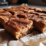 Cinnamon Sugar Blondies – Soft, Buttery, and Cinnamon-Kissed Treats 5 homemade cinnamon sugar blondies sliced on parchment – cozy kitchen dessert