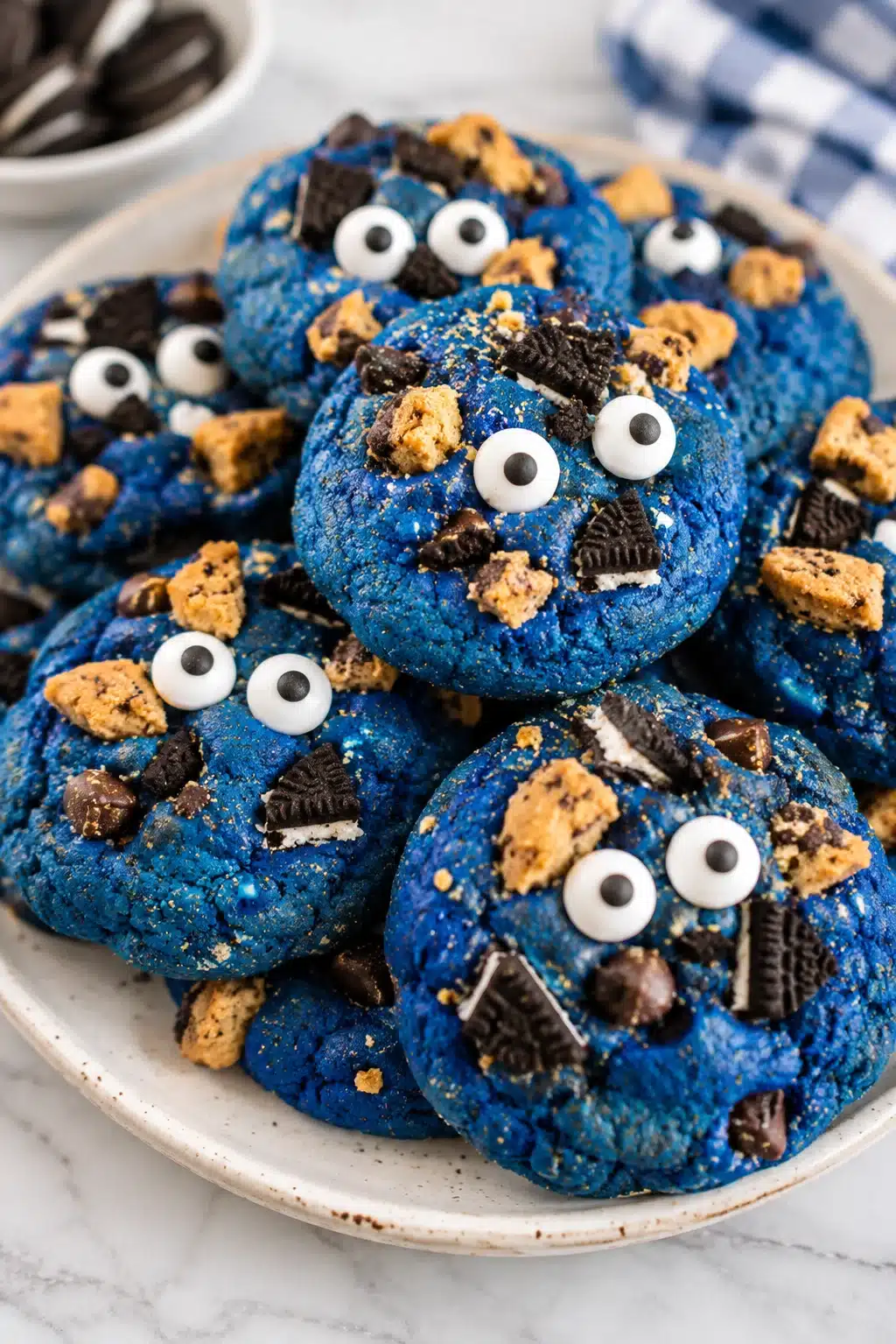 Cookie Monster cookies with blue dough, chocolate cookie pieces, and candy eyes