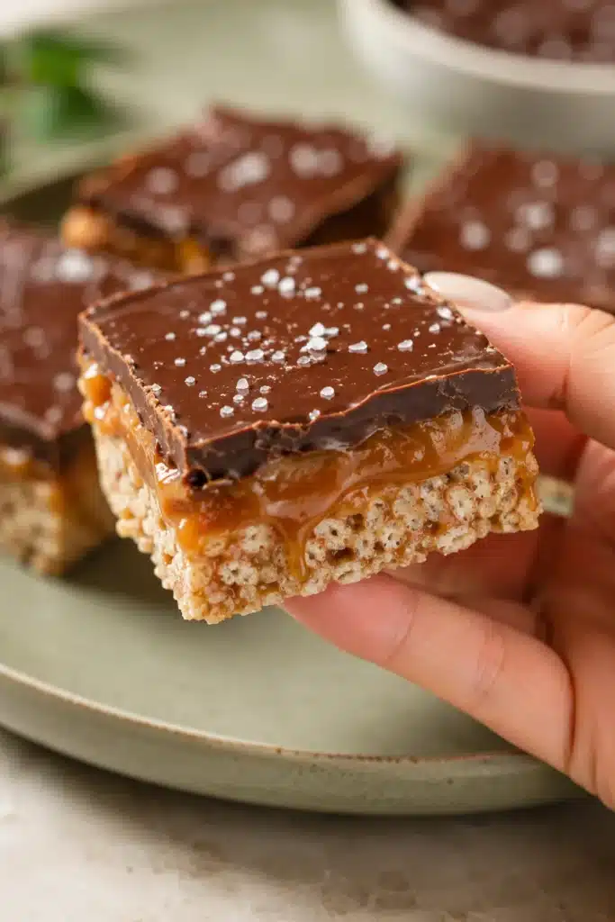 Caramel Chocolate Rice Krispies bars with gooey caramel, chocolate topping, and flaky sea salt.
